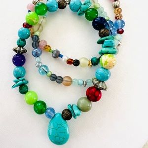 Multi colored stack of 3  beaded stretch bracelets